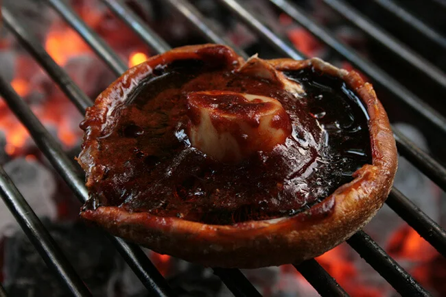 BBQ portobello mushroom on flame grill