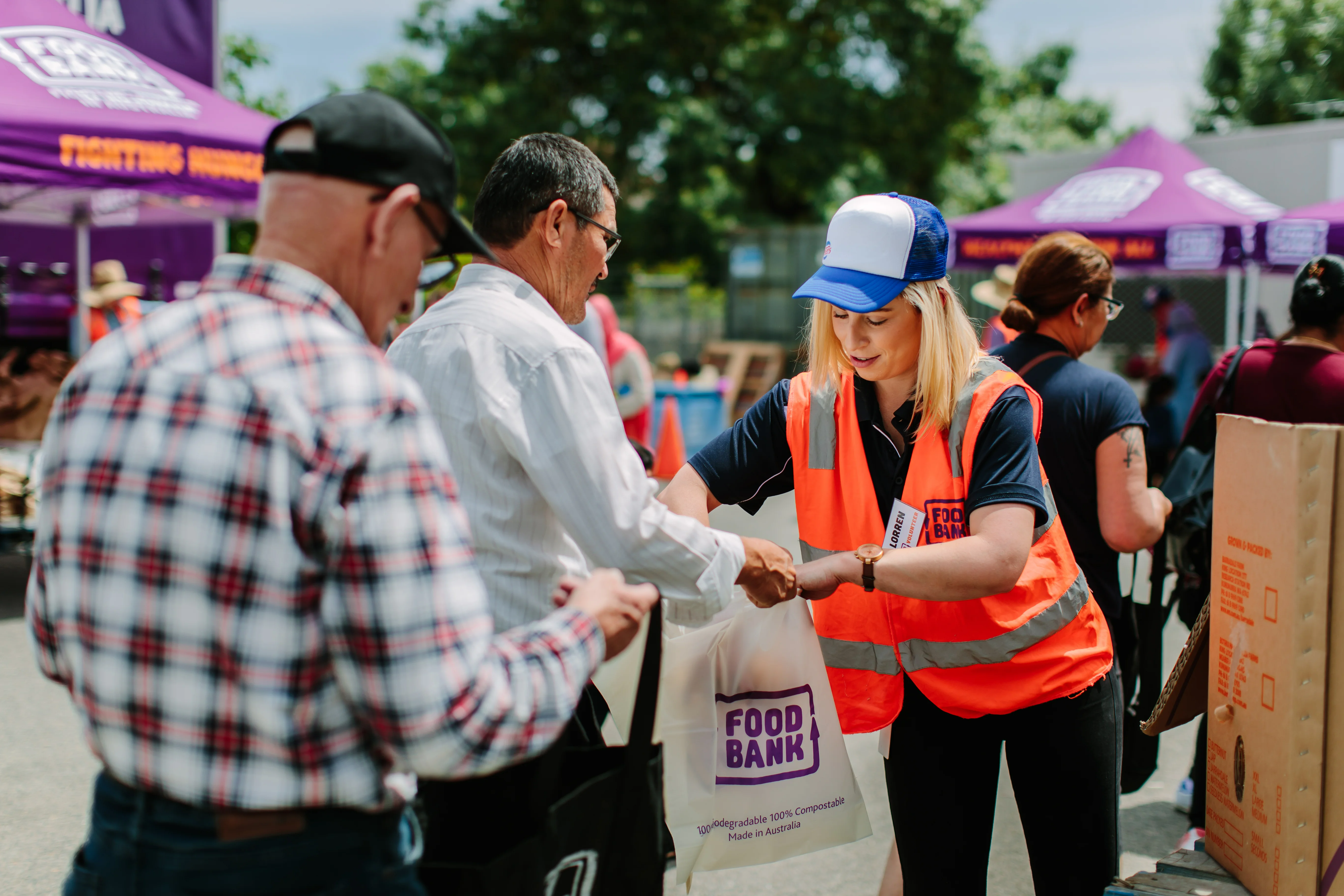 Woman Handing a Package to a Man