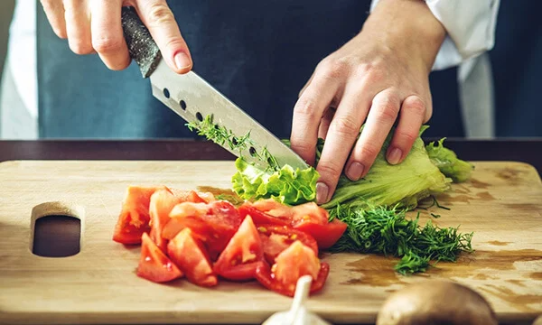 Chef chopping vegetables