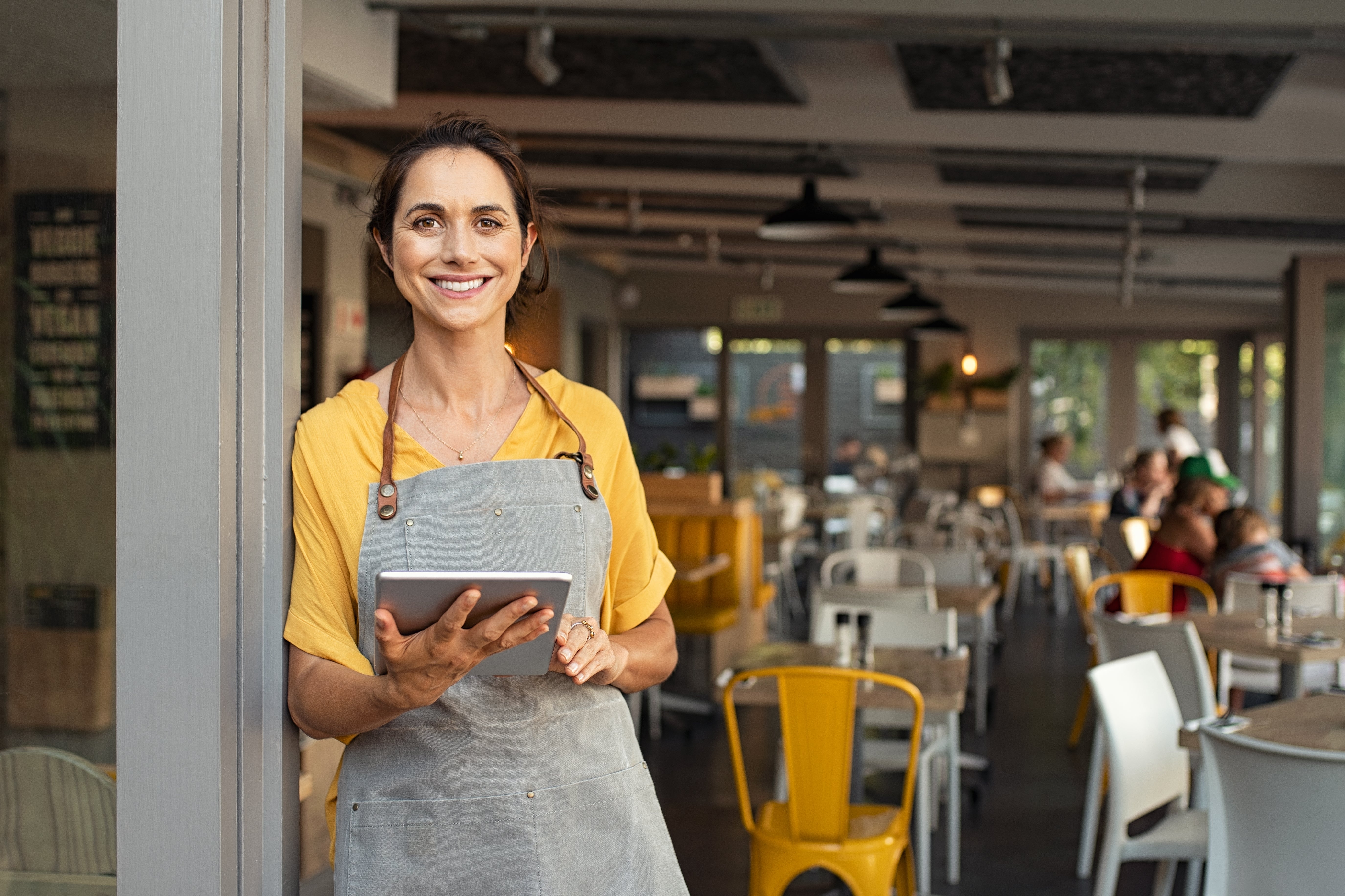 female cafe worker smiling
