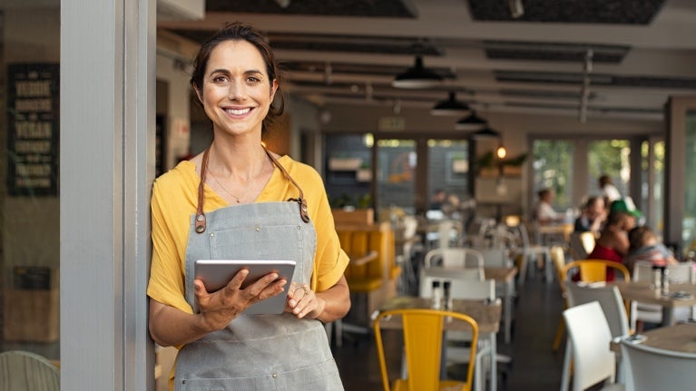 female cafe worker smiling