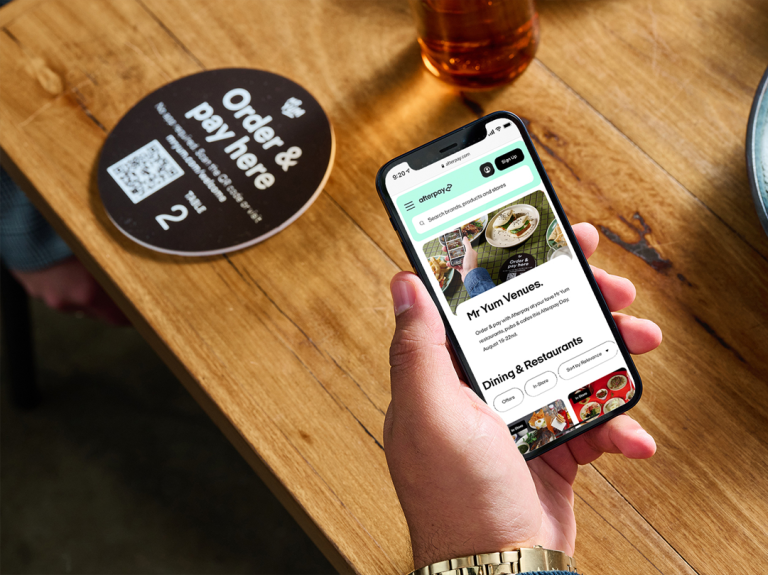 Customer scanning QR code menu with smartphone