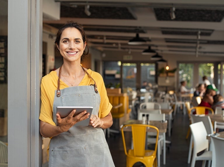 female cafe worker smiling