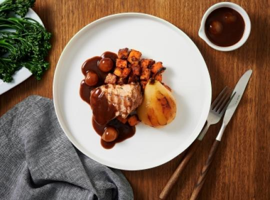 Pork fillet with sweet potato, caramelised pears, and a pickled onion red wine sauce