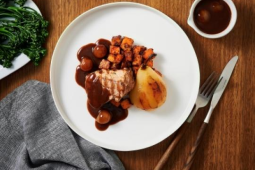 Pork fillet with sweet potato, caramelised pears, and a pickled onion red wine sauce